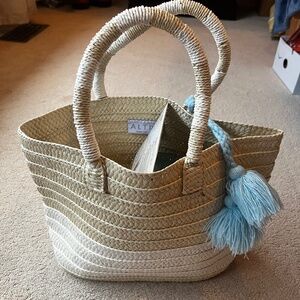ALTRU Made for Good Woven Straw Blue Tassel Beach Bag